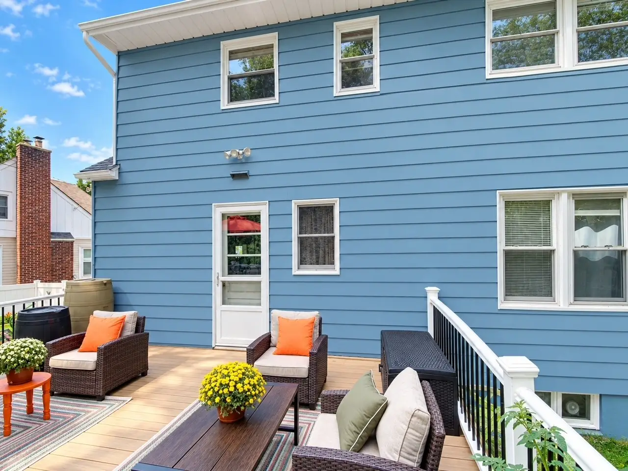 Painted blue siding and white trim above backyard deck in Netcong NJ