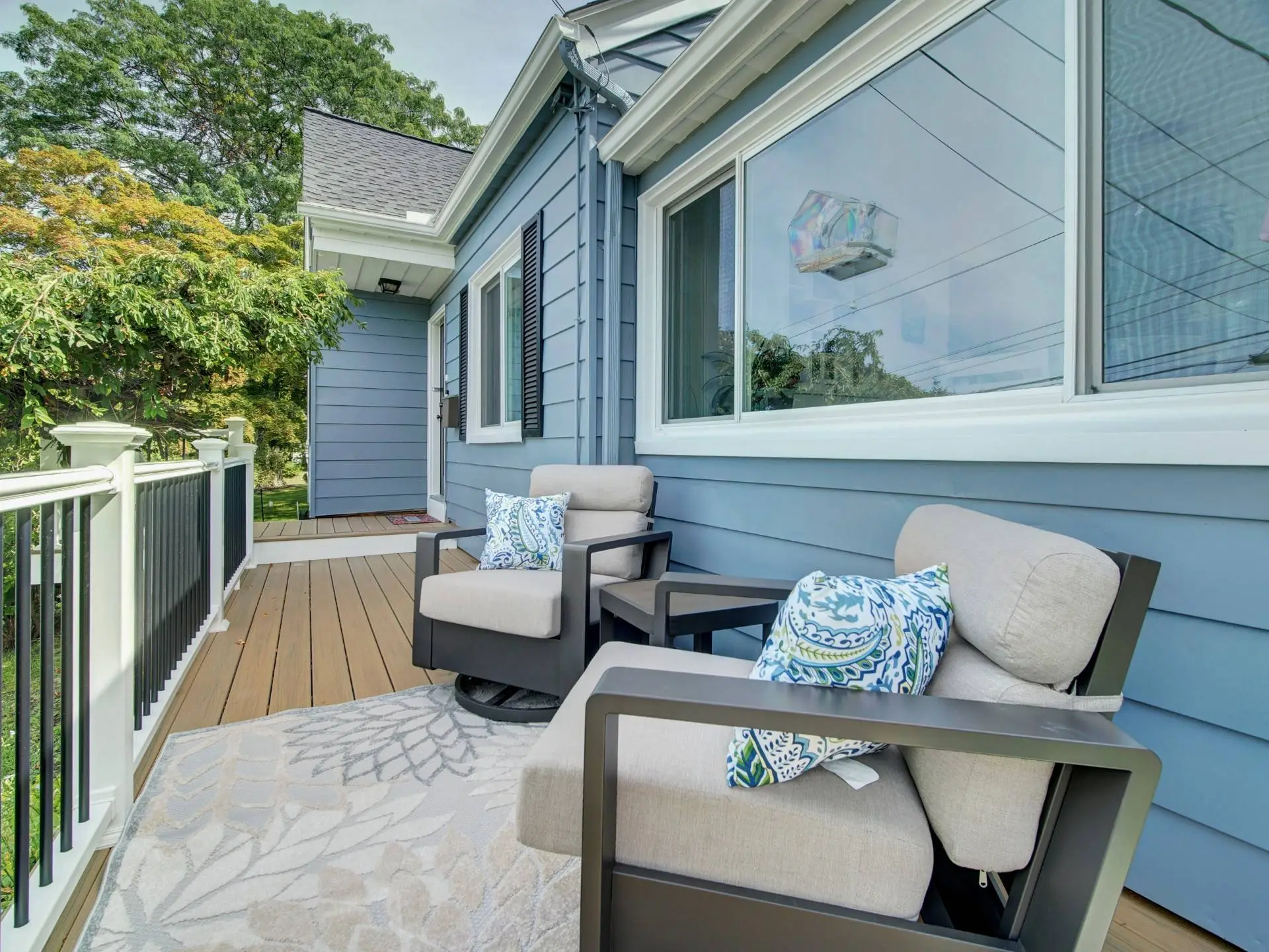 Front deck and side entry of painted blue home in Netcong NJ