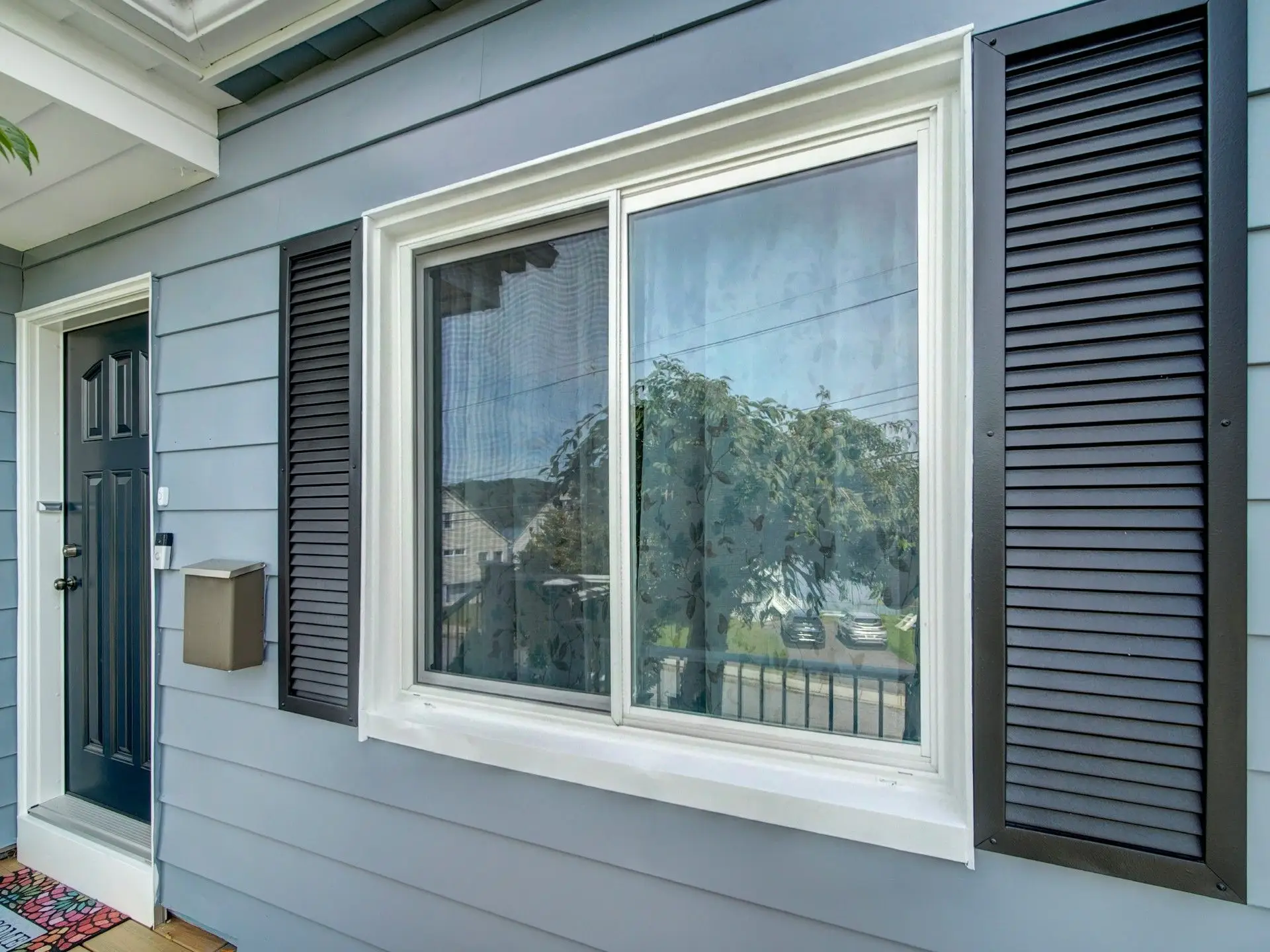 Window, black shutters and front door painted on Netcong NJ home exterior